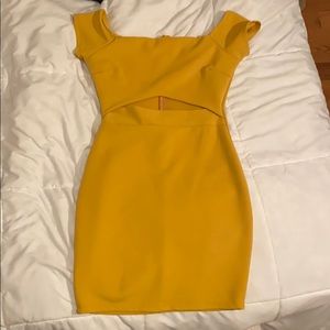 Shape-fitting, mustard yellow dress in Medium